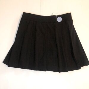 Brand new women skorts, size medium (slimming fit), black. Never worn.